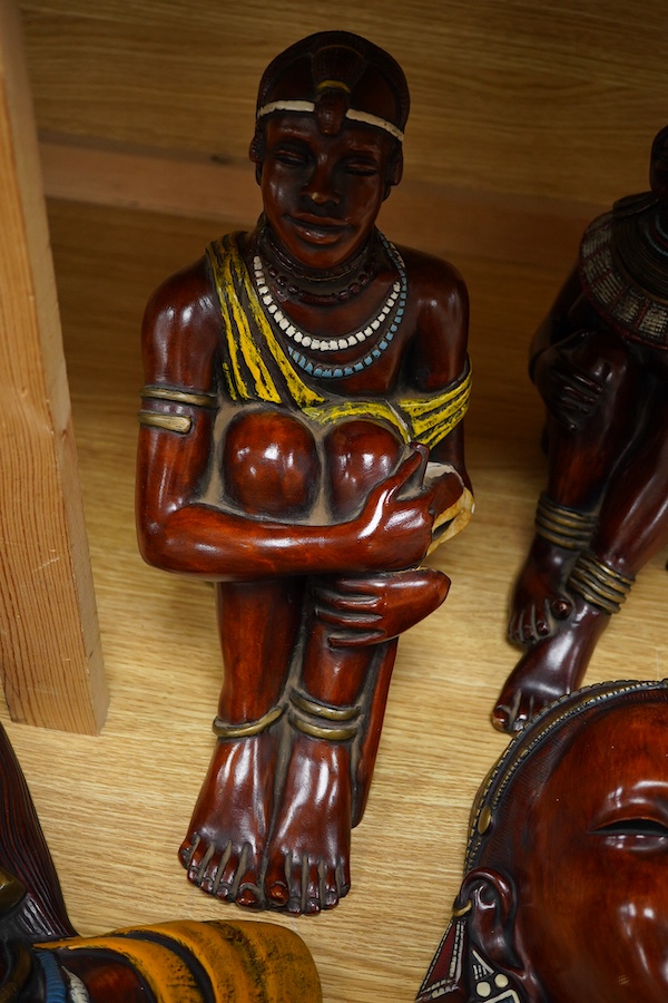 Four Kenyan faux wood figures/busts, signed Masai